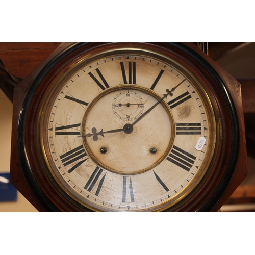 82 - Antique Ansonia clock in mahogany case with Roman numeral chapter ring and second subsidiary dial.