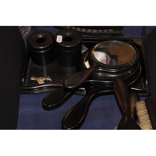 86 - Ebonised vanity sets, a floral decorated lacquered box and cover, another, etc.