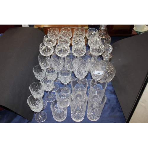 88 - Two glass decanters, hop glasses, tumblers, and others.