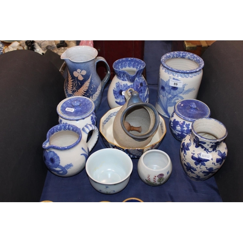 89 - Blue and white to include Buchan ware, South Lissens Pottery, a Whistlestop Pottery crock, etc.