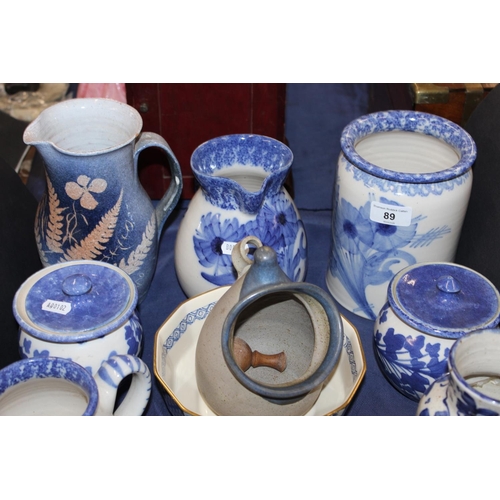 89 - Blue and white to include Buchan ware, South Lissens Pottery, a Whistlestop Pottery crock, etc.