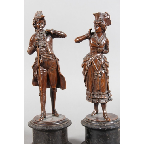 9 - Pair of bronzed effect antique figures on bases....