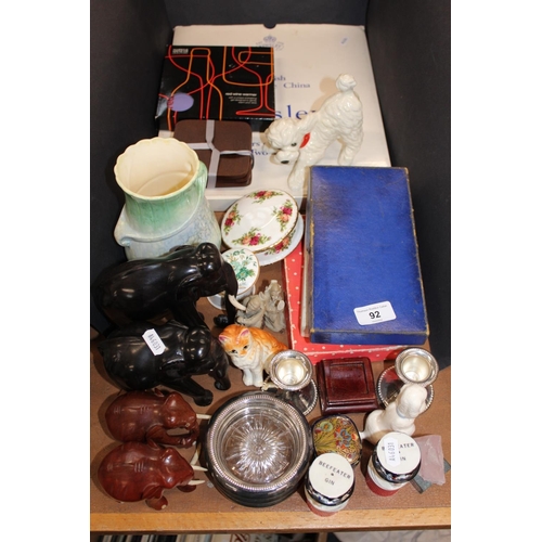 92 - Ebonised style elephants, cat models, hardwood stands, silver-plated candlesticks, flatware, coaster... 