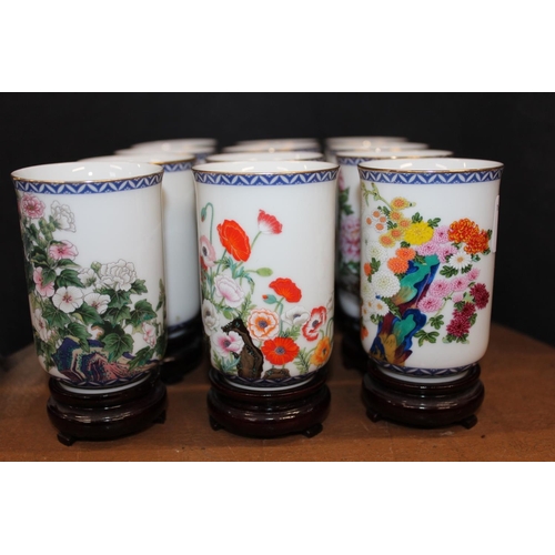 94 - Chinese Months of the Year porcelain vases on hardwood stands.