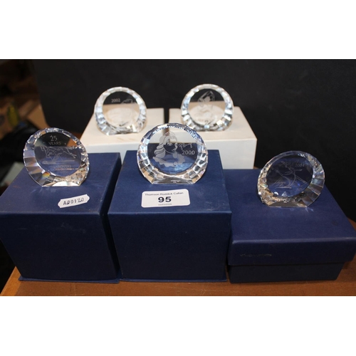 95 - Boxed Swarovski paperweights.