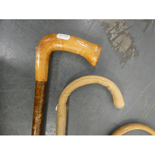 10 - Five walking sticks to include examples with horn handles.  (5)...