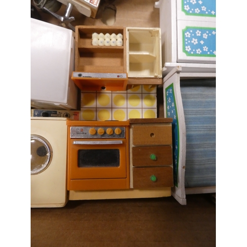 12 - Two cartons containing miscellaneous doll's furniture to include a shower, kitchen, table, sideboard...