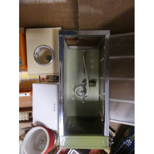 12 - Two cartons containing miscellaneous doll's furniture to include a shower, kitchen, table, sideboard...