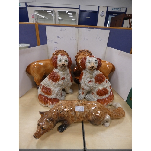 13 - Pair of Bo'ness lions (eyes lacking), pair of Staffordshire dogs and a fox with amber-coloured bead ...