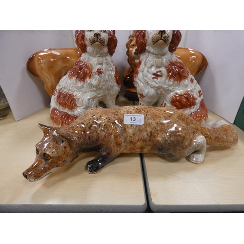13 - Pair of Bo'ness lions (eyes lacking), pair of Staffordshire dogs and a fox with amber-coloured bead ...