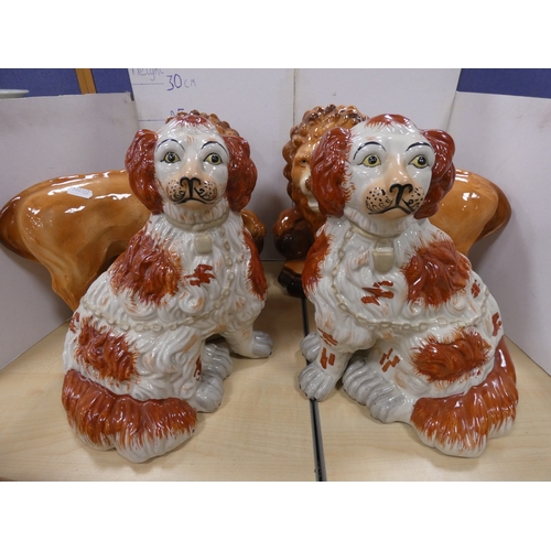 13 - Pair of Bo'ness lions (eyes lacking), pair of Staffordshire dogs and a fox with amber-coloured bead ...