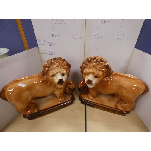 13 - Pair of Bo'ness lions (eyes lacking), pair of Staffordshire dogs and a fox with amber-coloured bead ...