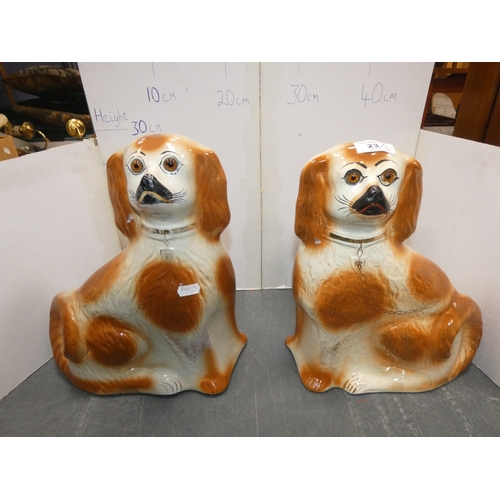 23 - Pair of Staffordshire wally dogs with amber-coloured glass eyes.  (2)...