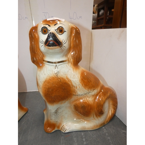 23 - Pair of Staffordshire wally dogs with amber-coloured glass eyes.  (2)...