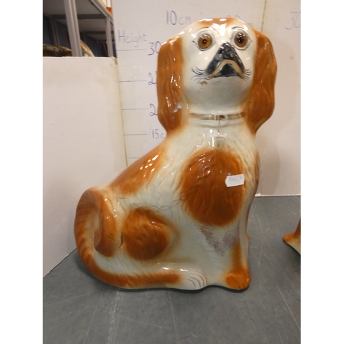 23 - Pair of Staffordshire wally dogs with amber-coloured glass eyes.  (2)...