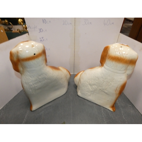 23 - Pair of Staffordshire wally dogs with amber-coloured glass eyes.  (2)...