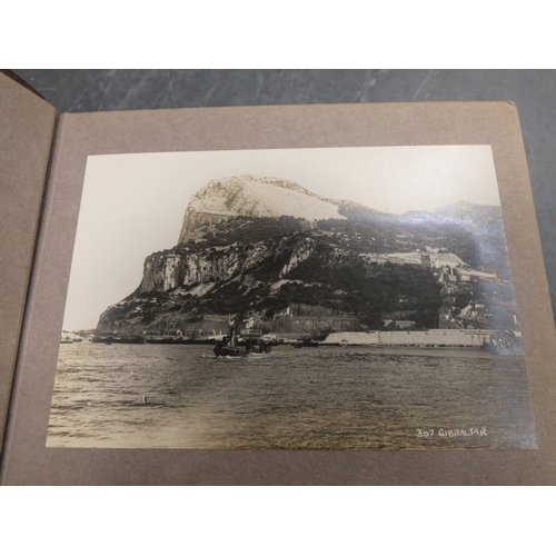 31 - Carton containing a chinoiserie table lamp, books, armorial plaques, postcard album etc....