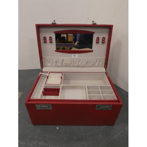 43 - Red jewellery chest with fitted interior and combination lock....