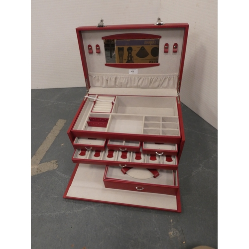 43 - Red jewellery chest with fitted interior and combination lock....