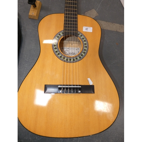 47 - Encore acoustic guitair, model ENC340FT, in carry case, and a guitar wall hook....