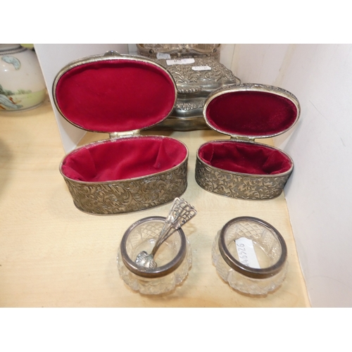 53 - Silver plated cruet set containing glass oil bottles, three white metal boxes, one in the form of a ...