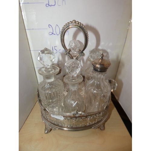 53 - Silver plated cruet set containing glass oil bottles, three white metal boxes, one in the form of a ...