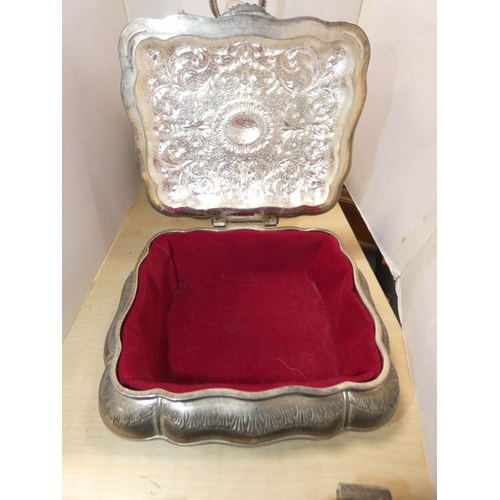 53 - Silver plated cruet set containing glass oil bottles, three white metal boxes, one in the form of a ...