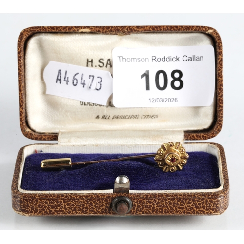 108 - 9ct gold stick pin set with a ruby, 0.9g