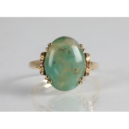 60 - 9ct gold ring set with a cloudy blue gemstone, ring size R/S, 3.7g