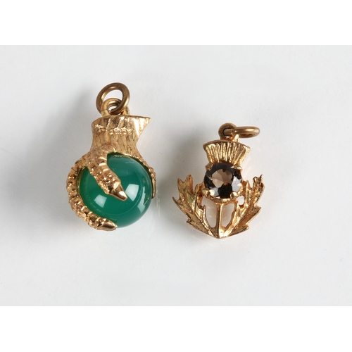 94 - 9ct gold claw charm and 9ct thistle charm, gross weight 5.8g