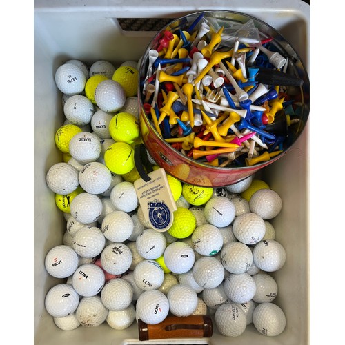 Collection of golf balls and tees.