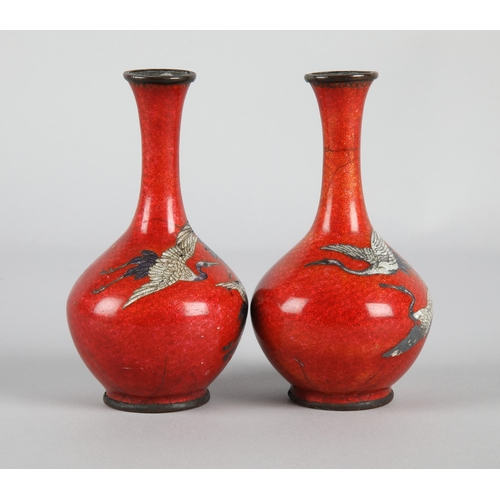 2 - Pair red ground cloisonne vases depicting cranes, each 12.5cm h. with impressed marks to base
