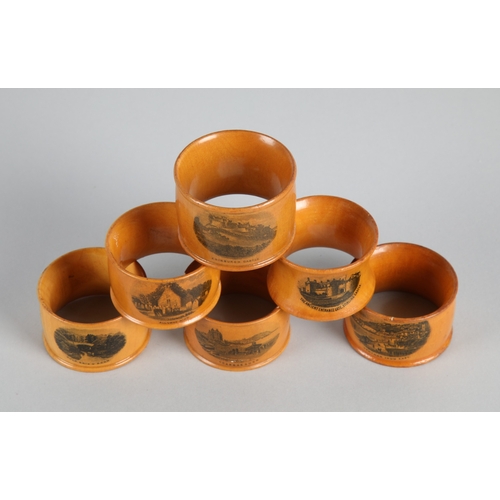25 - Collection of six Mauchline ware napkin rings (6).