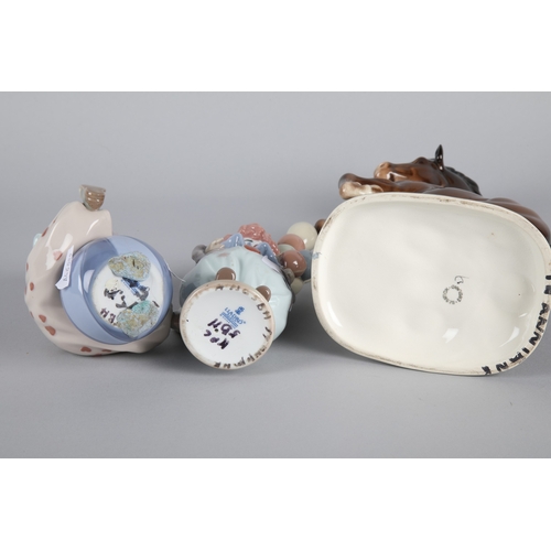 38 - Two Lladro figures to include Littlest Clown' 5811 and 'Having a Ball' 5813, with Beswick 'Rearing W... 