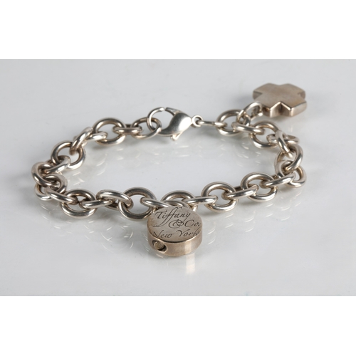 78 - Tiffany & Co. silver charm bracelet, 49g