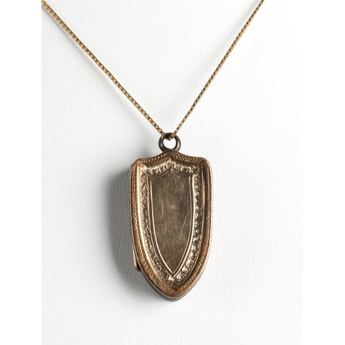 107 - Gilt locket of shield form on 9ct chain, chain weight 1g approx.