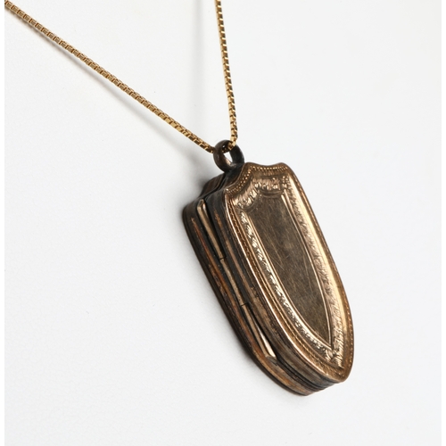 107 - Gilt locket of shield form on 9ct chain, chain weight 1g approx.
