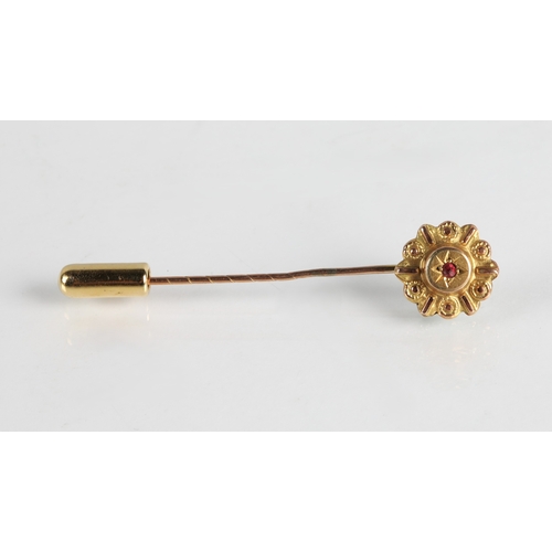 108 - 9ct gold stick pin set with a ruby, 0.9g