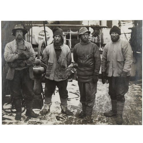 PONTING HERBERT G. Polar photograph, Scott`s Expedition.  Western Geological Party, Debenham, Griffith-Taylor, Gran & Forde on the deck of the Terra Nova after their return (1912) Gelatin silver print. Fine Art Society label to reverse (no 60 £1/1/-). 32cm x 43cm.