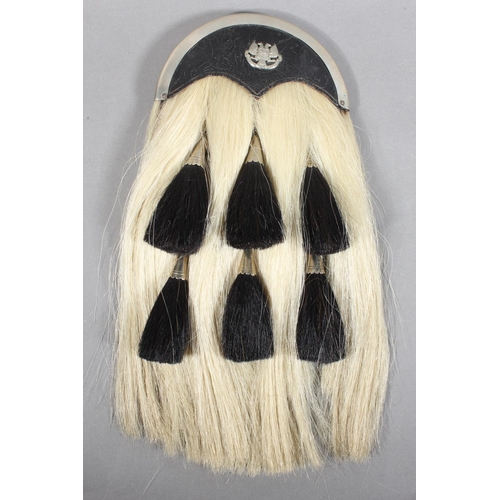 1711 - Scottish military style horse hair sporran having six black tassels, white metal and black leather c... 