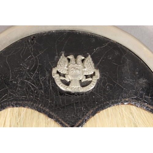 1711 - Scottish military style horse hair sporran having six black tassels, white metal and black leather c... 