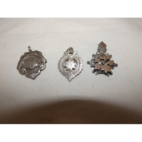 178 - Silver overlaid pendant and two silver medal fobs, 178g gross.  (3)
