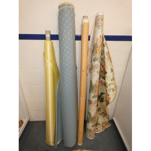 101 - Four rolls of fabric and cuts.