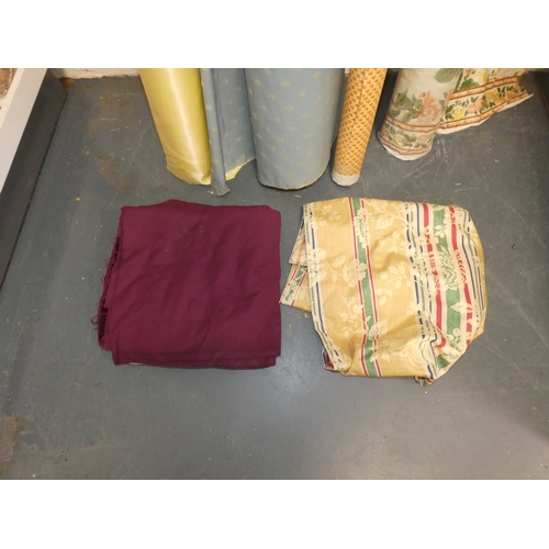 101 - Four rolls of fabric and cuts.