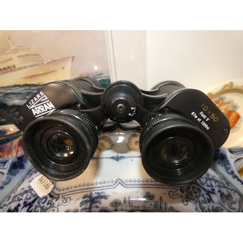 102 - Shelf lot of sundries to include pair of binoculars in case, P&O liner print, glass, ceramics an... 