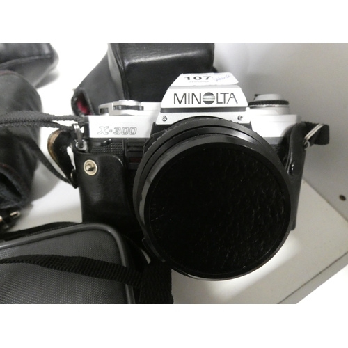 107 - Shelf lot of cameras to include Minolta X-300, digital camera, Super 8 cine camera and HP Deskjet pr... 