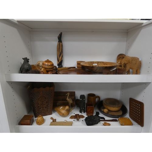 108 - Two shelves of treen and wood items to include bowls, figures, letter rack and ornaments.&nbsp;