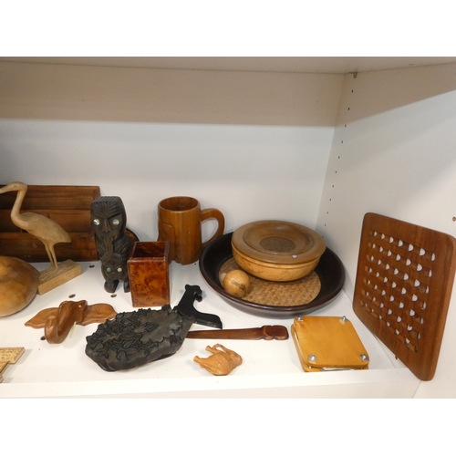 108 - Two shelves of treen and wood items to include bowls, figures, letter rack and ornaments.&nbsp;