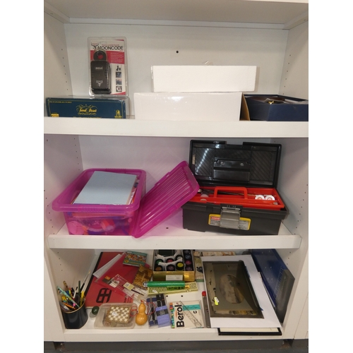 109 - Three shelves of sundries to include Trivial Pursuit game, art and craft items, paints, brushes etc.... 