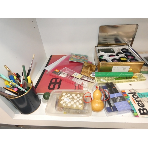 109 - Three shelves of sundries to include Trivial Pursuit game, art and craft items, paints, brushes etc.... 